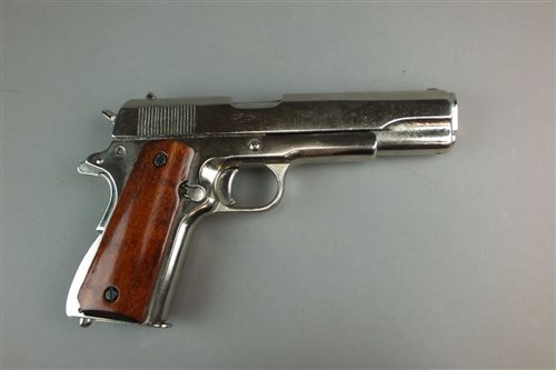Lot 298 - A Denix replica of a chrome US ARMY M1911 autoloading pistol, .45 calibre