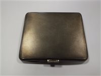 Lot 19 - An Art Deco silver and green guilloche enamel cigarette case