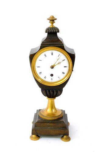 Lot 196 - A bronze and ormolu classical urn shaped timepiece, Regency period