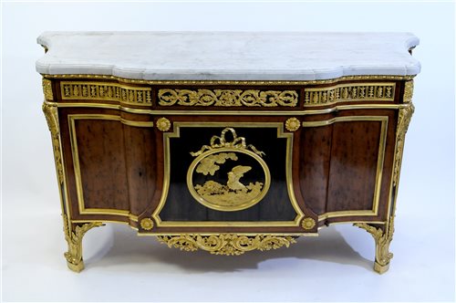 Lot 505 - A French Louis XVI style marble top plum pudding mahogany ebony and ormolu mounted commode