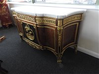 Lot 505 - A French Louis XVI style marble top plum pudding mahogany ebony and ormolu mounted commode