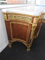 Lot 505 - A French Louis XVI style marble top plum pudding mahogany ebony and ormolu mounted commode