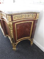 Lot 505 - A French Louis XVI style marble top plum pudding mahogany ebony and ormolu mounted commode