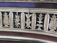 Lot 505 - A French Louis XVI style marble top plum pudding mahogany ebony and ormolu mounted commode