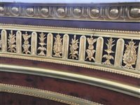 Lot 505 - A French Louis XVI style marble top plum pudding mahogany ebony and ormolu mounted commode