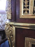 Lot 505 - A French Louis XVI style marble top plum pudding mahogany ebony and ormolu mounted commode