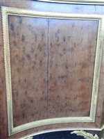Lot 505 - A French Louis XVI style marble top plum pudding mahogany ebony and ormolu mounted commode