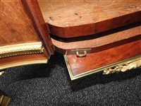 Lot 505 - A French Louis XVI style marble top plum pudding mahogany ebony and ormolu mounted commode