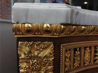 Lot 505 - A French Louis XVI style marble top plum pudding mahogany ebony and ormolu mounted commode