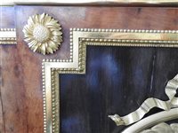 Lot 505 - A French Louis XVI style marble top plum pudding mahogany ebony and ormolu mounted commode