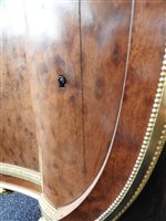 Lot 505 - A French Louis XVI style marble top plum pudding mahogany ebony and ormolu mounted commode
