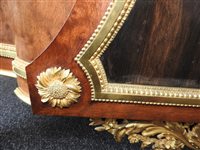Lot 505 - A French Louis XVI style marble top plum pudding mahogany ebony and ormolu mounted commode