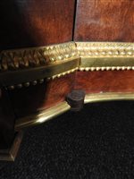 Lot 505 - A French Louis XVI style marble top plum pudding mahogany ebony and ormolu mounted commode