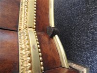 Lot 505 - A French Louis XVI style marble top plum pudding mahogany ebony and ormolu mounted commode