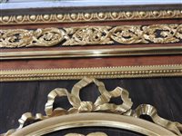 Lot 505 - A French Louis XVI style marble top plum pudding mahogany ebony and ormolu mounted commode