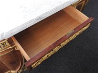 Lot 505 - A French Louis XVI style marble top plum pudding mahogany ebony and ormolu mounted commode