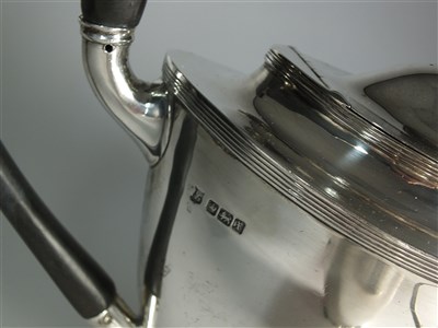 Lot 57 - A three piece silver tea service