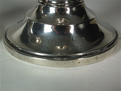 Lot 20 - A pair of silver mounted candlesticks