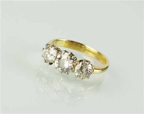 Lot 171 - An 18ct gold three stone diamond ring