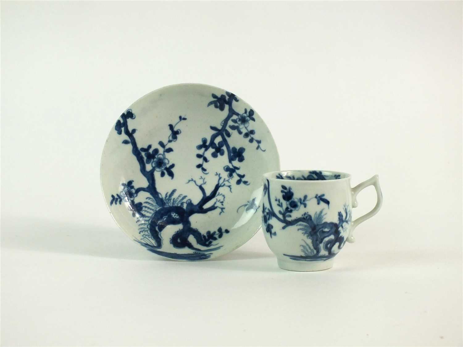 Lot 45 - A Worcester Prunus Root coffee cup and saucer