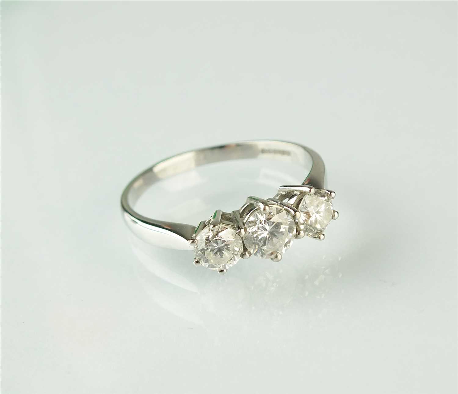 Lot 258 - An 18ct gold three stone diamond ring