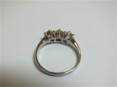 Lot 258 - An 18ct gold three stone diamond ring