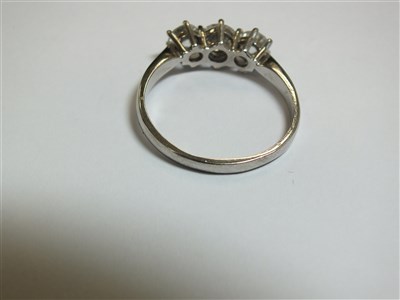Lot 258 - An 18ct gold three stone diamond ring