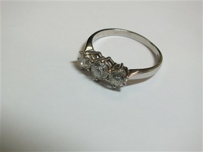 Lot 258 - An 18ct gold three stone diamond ring