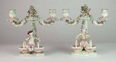 Lot 166 - A pair of German porcelain figural sweetmeat candelabra