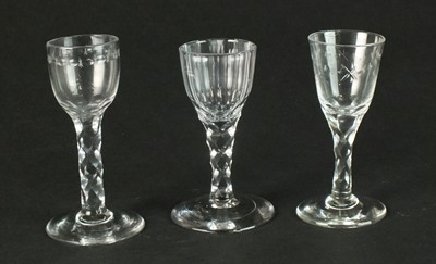 Lot 176 - Three late 18th-century/early 19th century facet-cut stem wine glasses