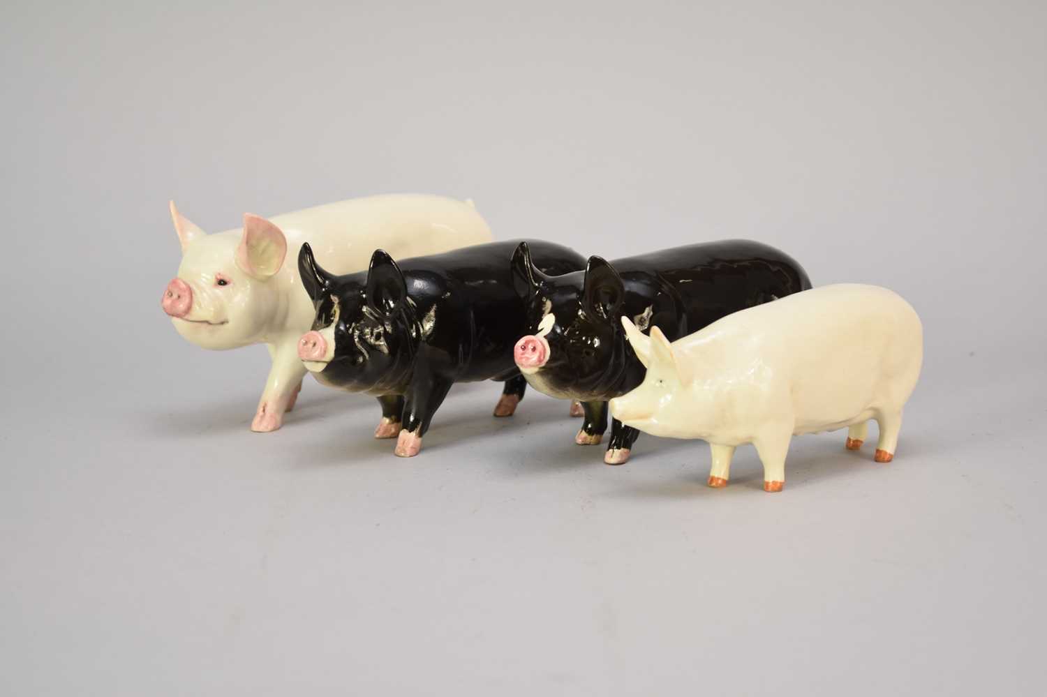 Lot 333 - Four Beswick pigs