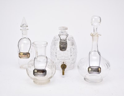 Lot 76 - A collection of four silver decanter labels