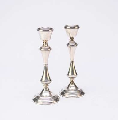 Lot 77 - A pair of silver mounted candlesticks