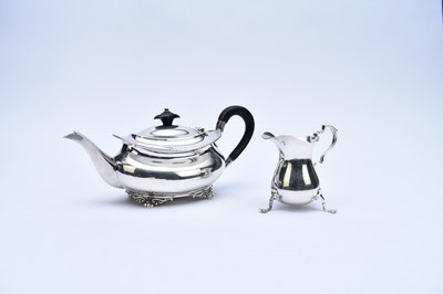 Lot 35 - A silver teapot and cream jug