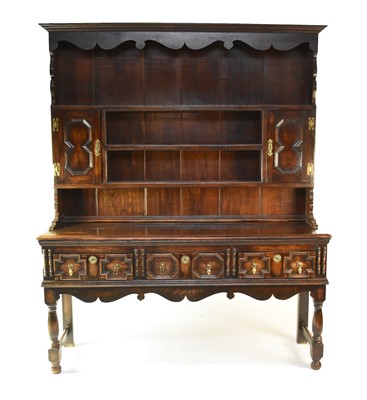 Lot 671 - A 20th century, stained oak, Jacobean style dresser