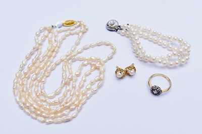 Lot 106 - An early 20th century diamond cluster ring and a collection of cultured pearl jewellery