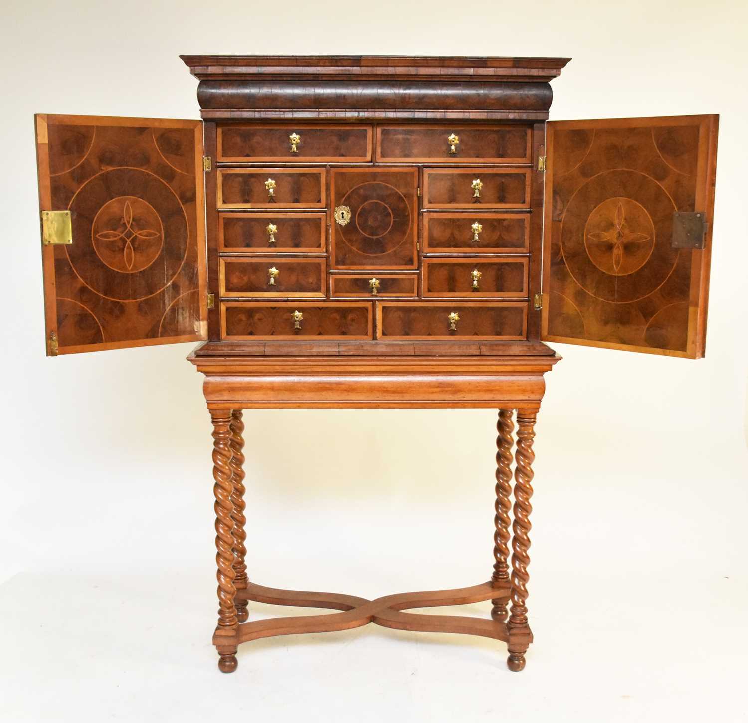 Lot 295 - A William and Mary oyster veneered cabinet on a later stand