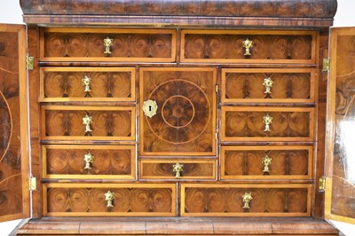 Lot 295 - A William and Mary oyster veneered cabinet on a later stand