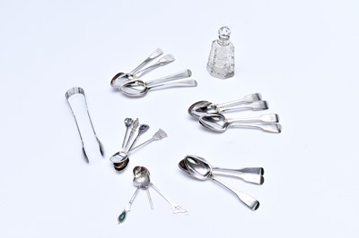 Lot 56 - A collection of silver and white metal spoons and sugar tongs