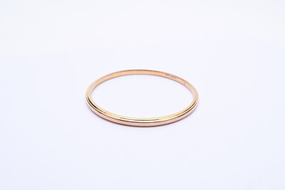 Lot 202 - A 9ct gold slave bangle