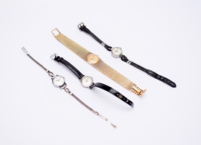 Lot 229 - Omega: A lady's 9ct gold dress watch and three other lady's watches