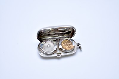 Lot 67 - A silver sovereign case and a half sovereign