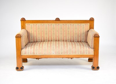 Lot 423 - A Biedermeier parcel ebonised maple sofa