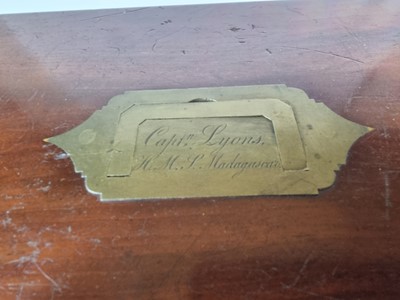 Lot 5 - A mahogany box named to Captain Lyons, H.M.S Madagascar