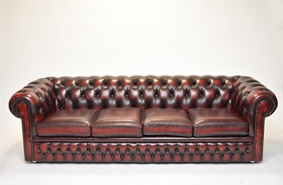 Lot 432 - A leather Chesterfield four-seater sofa