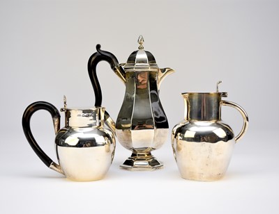 Lot 1 - A silver hot water jug and two silver jugs