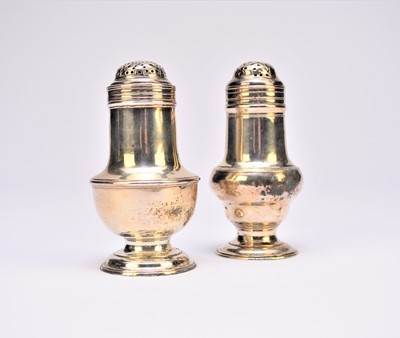 Lot 7 - Two silver bun pepper pots