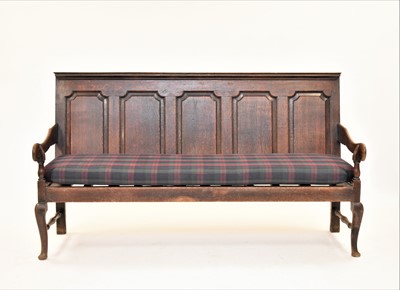 Lot 390 - An 18th century oak settle
