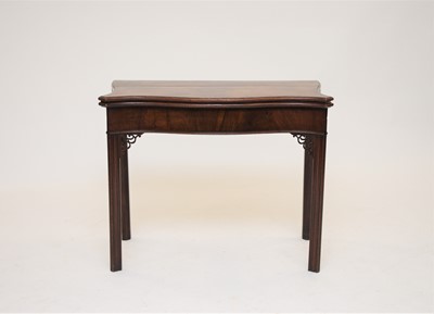 Lot 404 - A George III mahogany fold-over card table