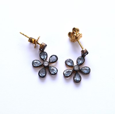 Lot 50 - A pair of blue topaz and diamond floral earrings